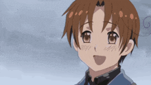 a boy with brown hair is smiling and looking up