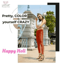 a woman is standing on a sidewalk wearing red pants and a white top .