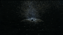 a starry night sky with a flying object in the middle