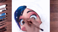 a person is drawing a cartoon character with a pencil that says lumograph