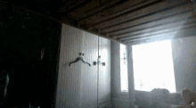 a picture of a room with a hanger on the wall