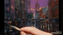 a person is painting a city scene with the words made in animotica below