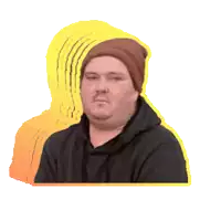 a man wearing a beanie and a black hoodie looks at the camera
