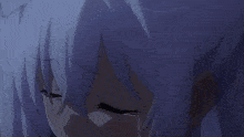 a boy is laying on a bed with a white blanket