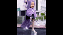 a doll with purple hair and a purple coat is walking down a street .