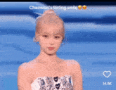 a picture of a girl with the caption " chaewon 's flirting smile " on it
