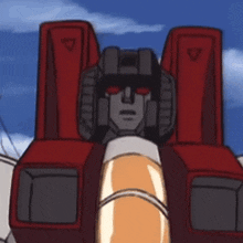 a close up of a robot 's head with red eyes