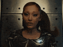 a close up of a woman 's face with a tattoo that says ariana grande