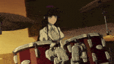 a girl is playing a drum set with a robot arm