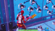 a person is playing a video game while holding a star and a hammer .