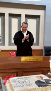 richter ulrich wetzel stands in front of a cake