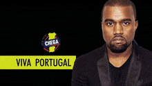 a man with a beard is standing in front of a sign that says viva portugal