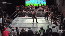 a jcw wrestling match is being shown on the screen