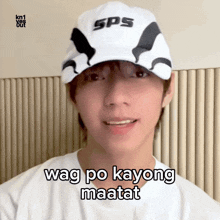 a man wearing a sps hat says wag po kayong maant