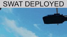 a swat helicopter is flying in the sky