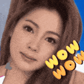 a close up of a woman 's face with the words wow on the bottom right