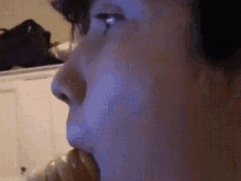 a close up of a person 's face with a blurred background