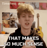 a young man says that makes so much sense in front of a timefest poster