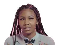 a close up of a woman 's face with braids and earrings