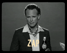 a man in a suit holds a bottle of nuka cola and says thirst