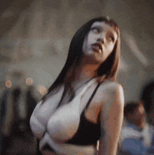 a woman in a black bra is looking up