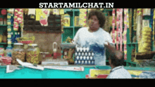 a man in a store with the words starttamilchat.in on the bottom right