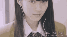 a girl wearing ear buds with major ep on the bottom