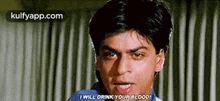a man in a blue shirt is making a funny face and says `` i will drink your blood '' .