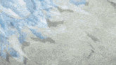 a person is standing in front of a pile of ice and ice cubes .