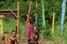 a group of people are playing a game called survivor and one of the flags says ' a ' on it