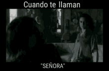 two women are standing next to each other in a dark room with the words " cuando te llaman " on the bottom