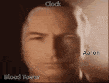 a close up of a man 's face with the words clock blood tower and aaron written on it