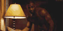 Black Guy Turns Off Lamp GIF - Black Guy Turns Off Lamp Good Night GIFs
