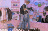 a man is standing in a closet full of clothes and shoes