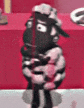 a cartoon sheep is standing in front of a red wall holding a trophy .