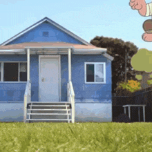 a blue house with a porch and stairs in front of it