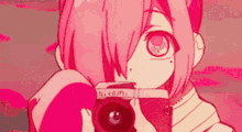 a pink haired anime girl is holding a camera in front of her face .