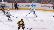 a hockey game is being played in front of an advertisement for highmark