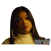 a poster for trap city shows a woman with long hair and hoop earrings