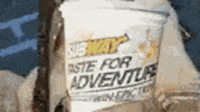 a subway cup that says taste for adventure on it