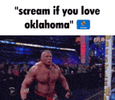 a man in a wrestling ring with the words " scream if you love oklahoma " below him