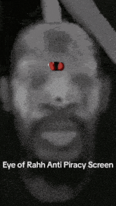 a black and white photo of a man 's face with the words eye of rahh anti piracy screen below it