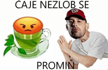 a man wearing a red w hat stands next to a cup of green tea