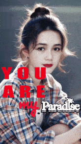 a girl in a plaid shirt with the words " you are my paradise " on her face