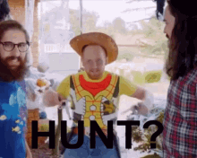 a man wearing a cowboy hat and a shirt that says hunt on it