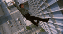 a man is falling from a building with his mouth open