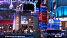 an advertisement for the american ninja warrior shows a man jumping in the air