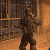 a man in a gas mask is standing in front of a fence with a percentage of 100 %