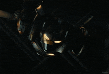 a close up of a robot with sparks coming out of it 's face