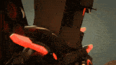 a robot with red lights on it 's arms
